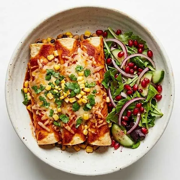 Corn and black eye bean enchiladas with pomegranate salad